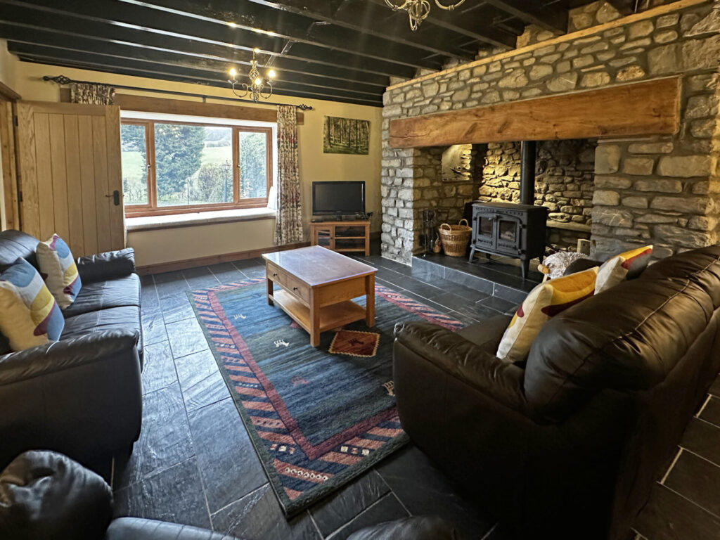 cosy living room, wood burning stove, inglenook fireplace, spacious living room, country cottage, Basel Cottage, Brecon Beacons, Cambrian Mountains