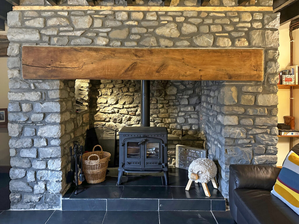 cosy living room, wood burning stove, inglenook fireplace, spacious living room, country cottage, Basel Cottage, Brecon Beacons, Cambrian Mountains