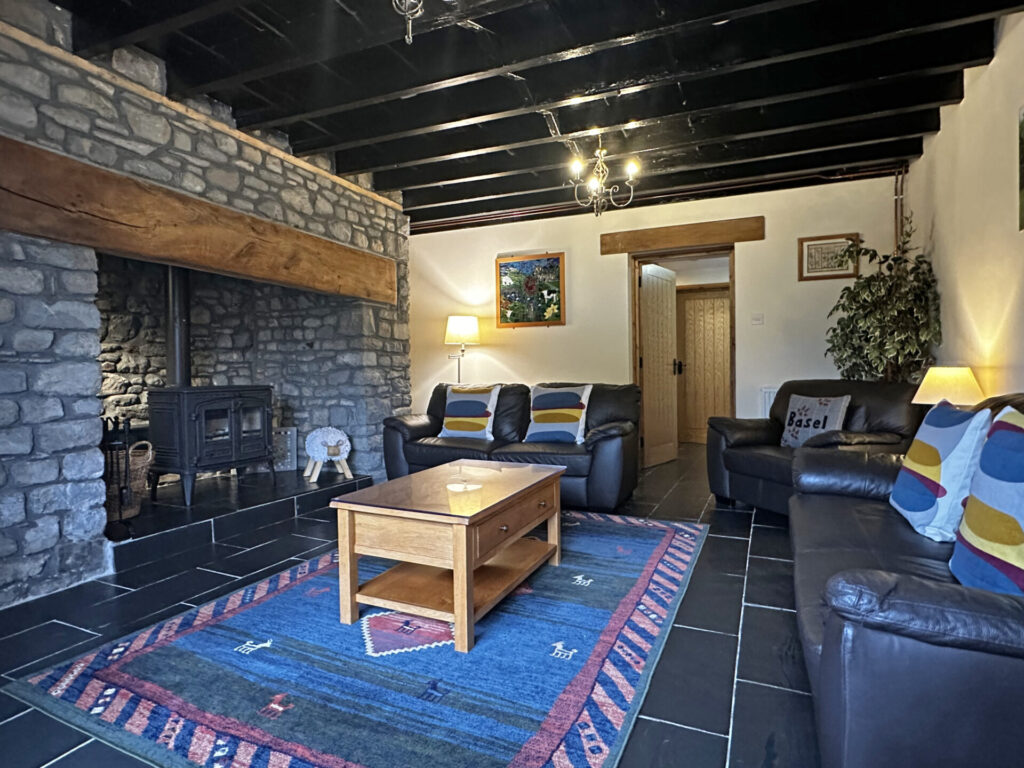 cosy living room, wood burning stove, inglenook fireplace, spacious living room, country cottage, Basel Cottage, Brecon Beacons, Cambrian Mountains